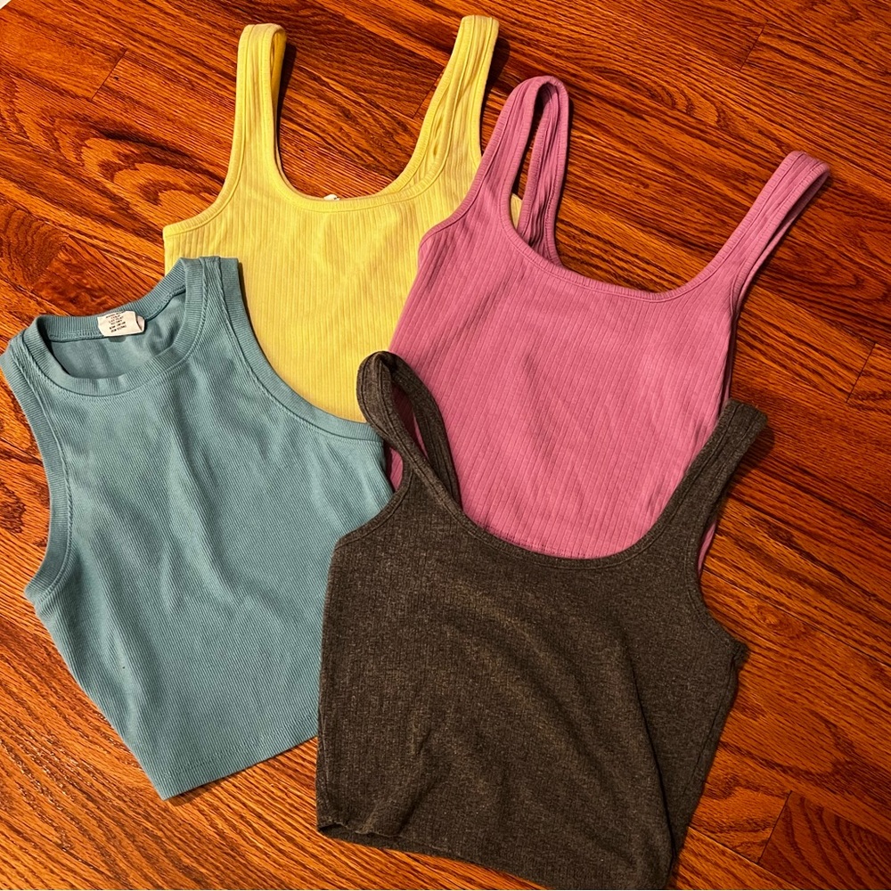 assortment of tilly’s tanks